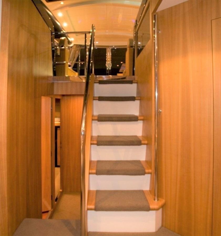 a set of stairs in a building aboard BON VIVANT Yacht for Sale