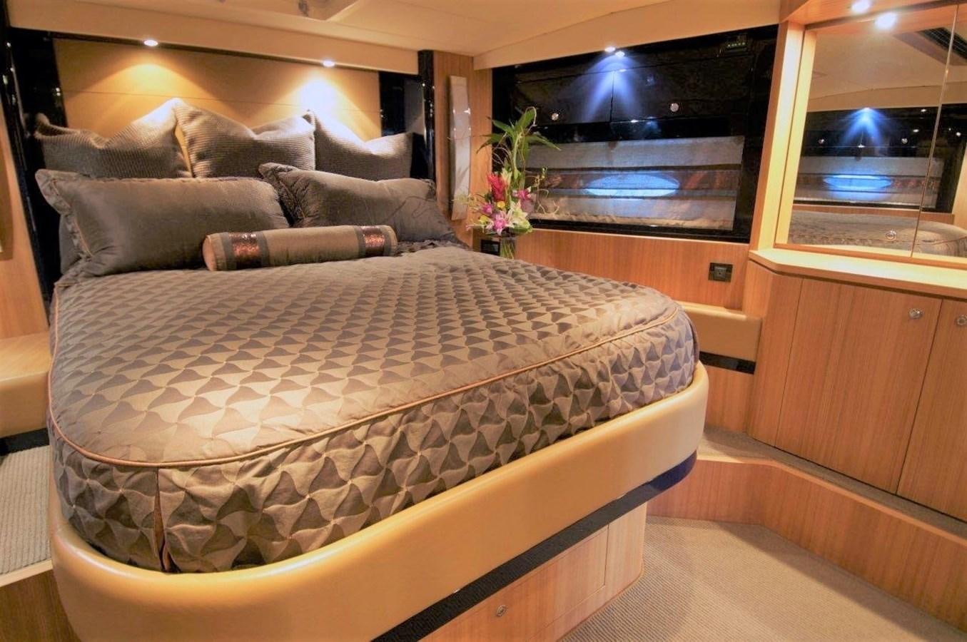 a bed in a room aboard BON VIVANT Yacht for Sale