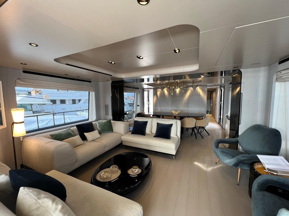 a living room with a large window aboard QUEEN ANA Yacht for Sale