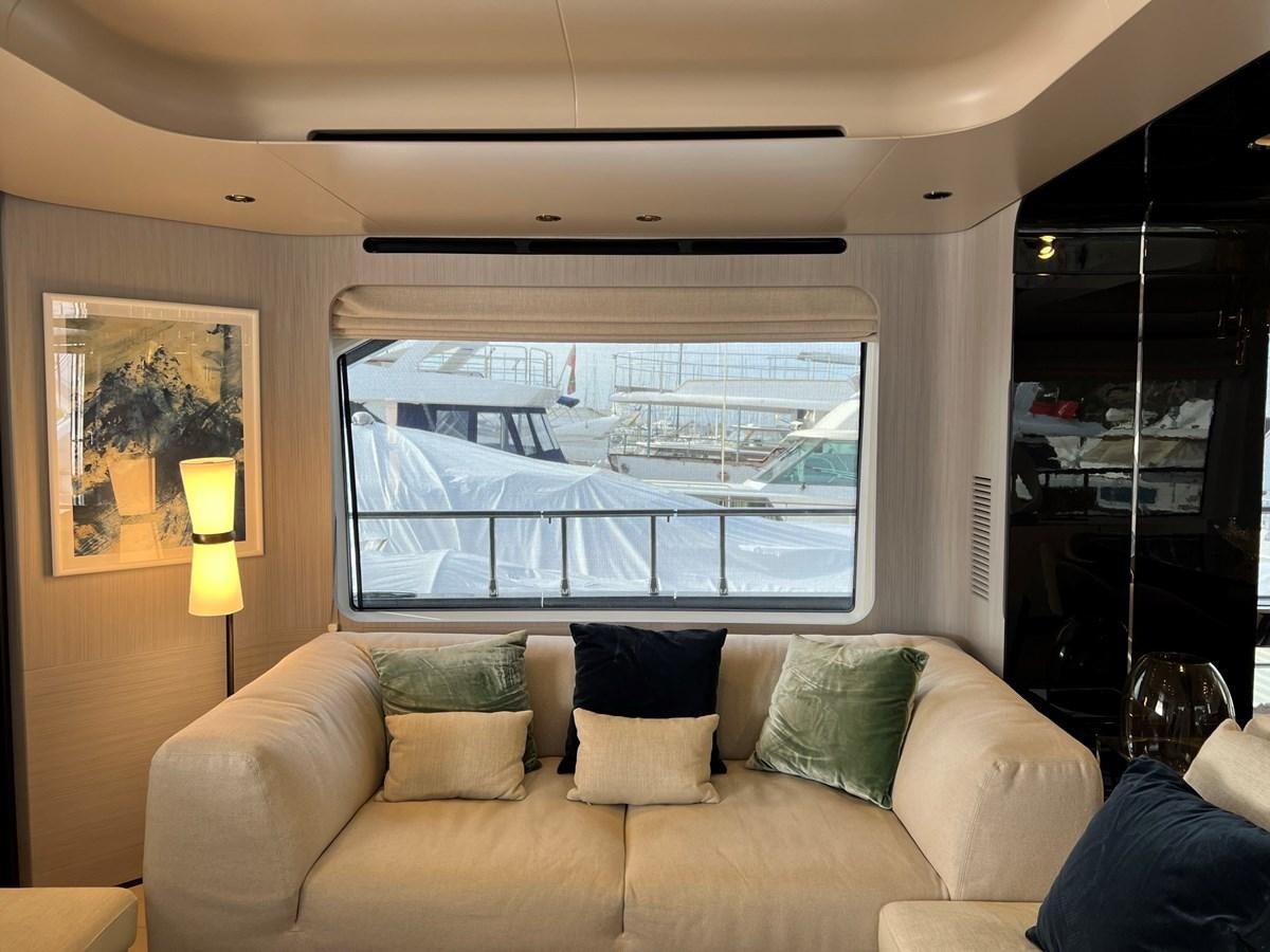 a living room with a large window aboard QUEEN ANA Yacht for Sale