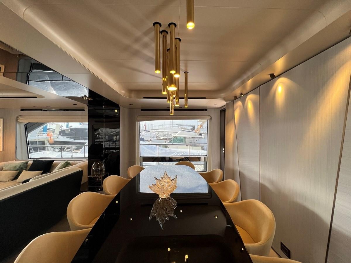 a dining room with a chandelier aboard QUEEN ANA Yacht for Sale
