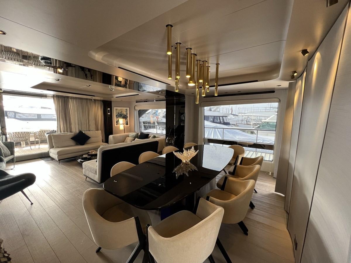 a living room with a large window aboard QUEEN ANA Yacht for Sale
