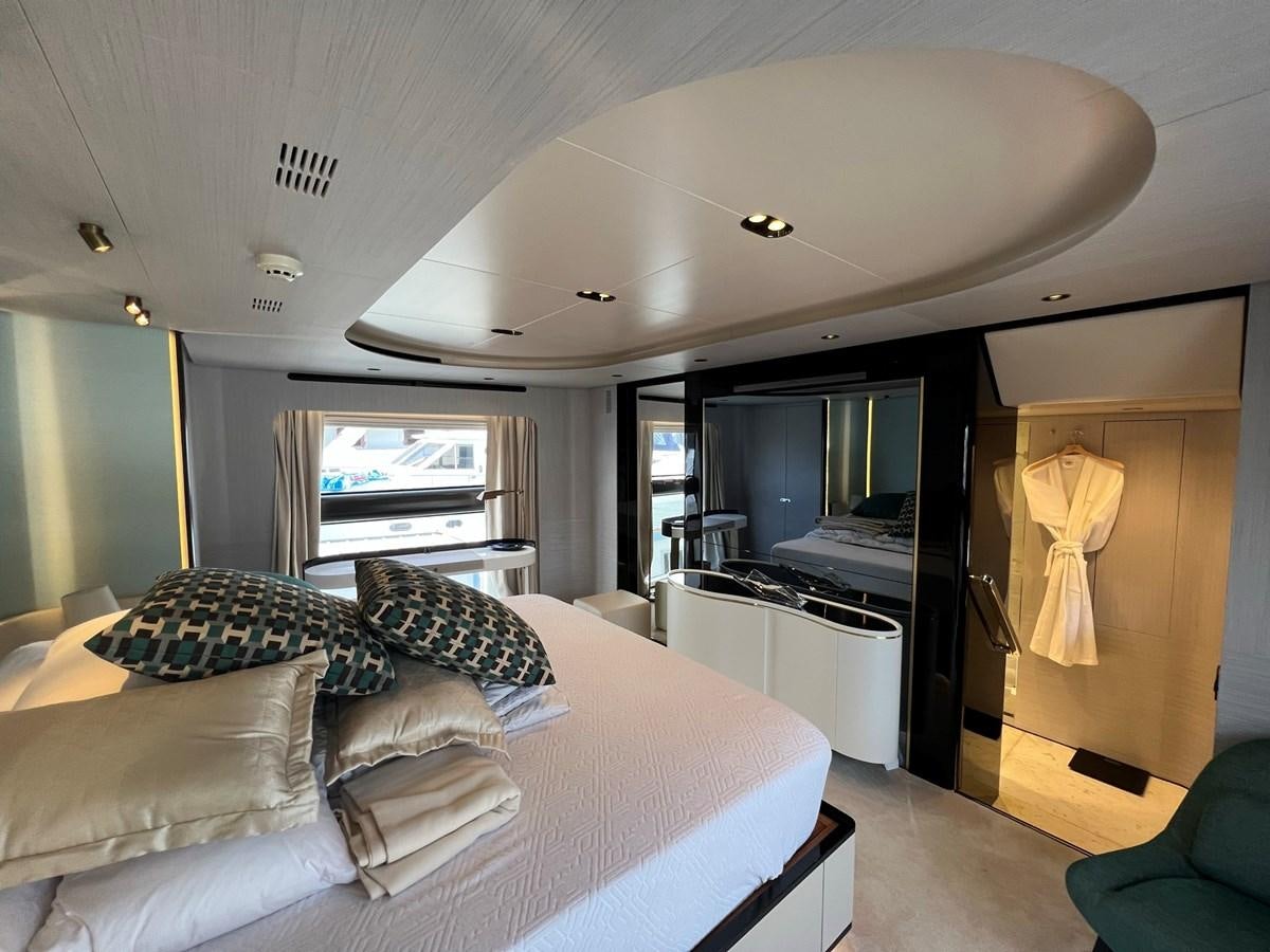 a bedroom with a bed and a closet aboard QUEEN ANA Yacht for Sale