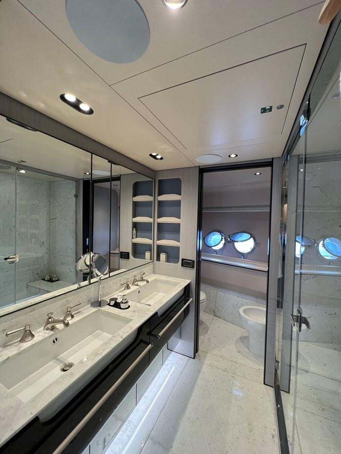 a bathroom with a large mirror aboard QUEEN ANA Yacht for Sale
