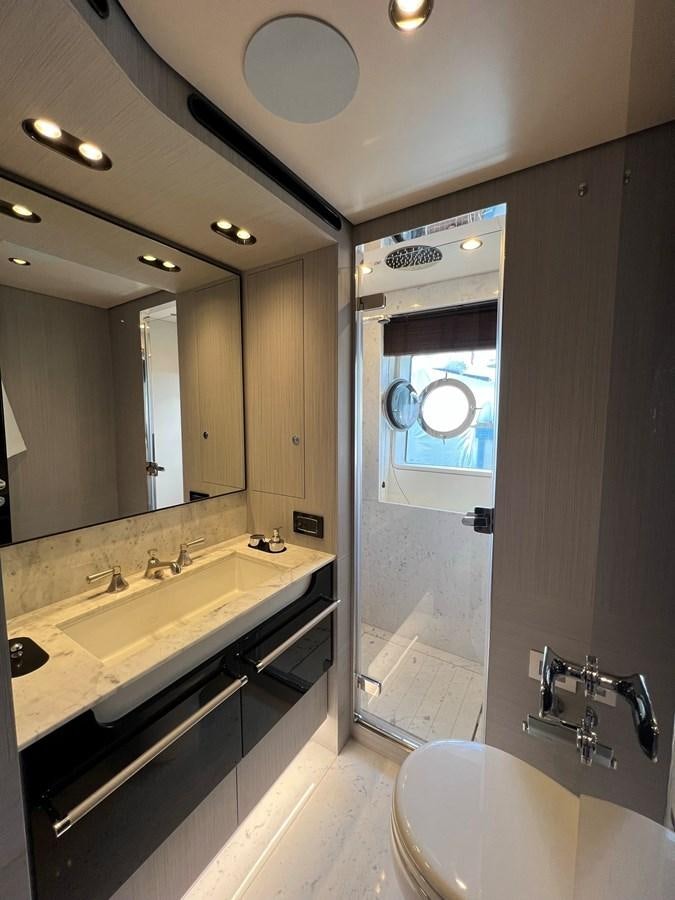 a bathroom with a large mirror aboard QUEEN ANA Yacht for Sale