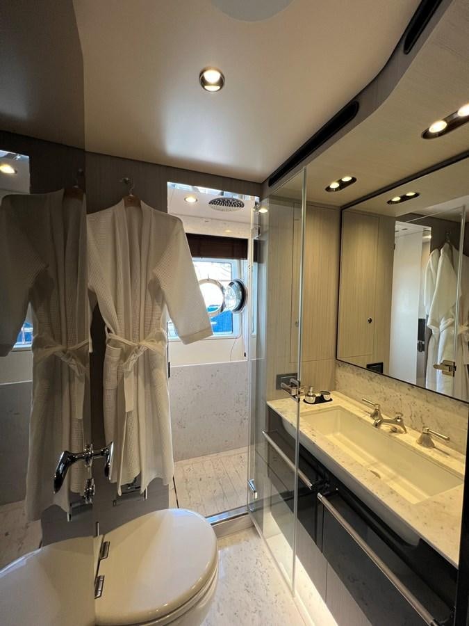 a bathroom with a bathtub sink and a mirror aboard QUEEN ANA Yacht for Sale