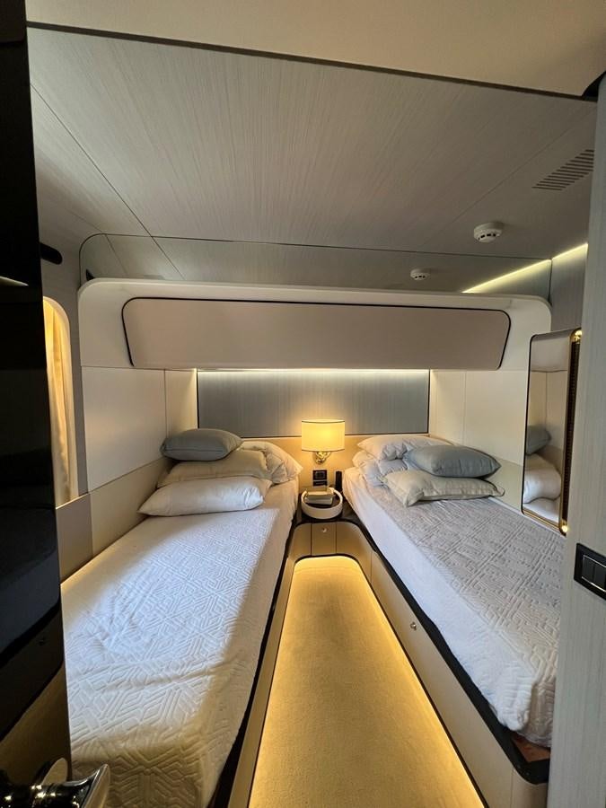 a couple of beds in a hotel room aboard QUEEN ANA Yacht for Sale