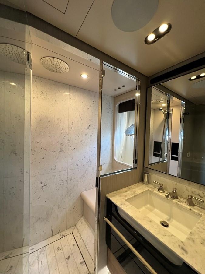 a bathroom with a large mirror aboard QUEEN ANA Yacht for Sale