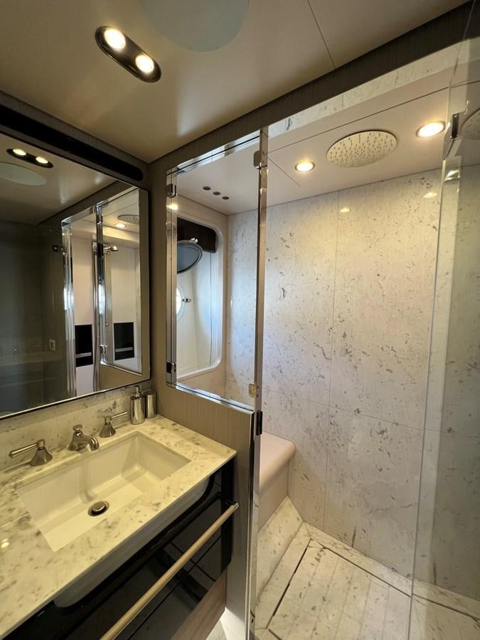 a bathroom with a large mirror aboard QUEEN ANA Yacht for Sale