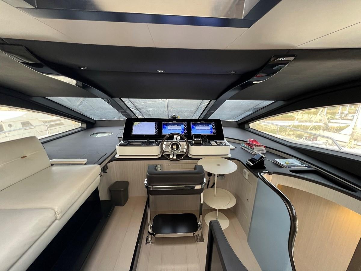inside of a vehicle with desks and chairs aboard QUEEN ANA Yacht for Sale
