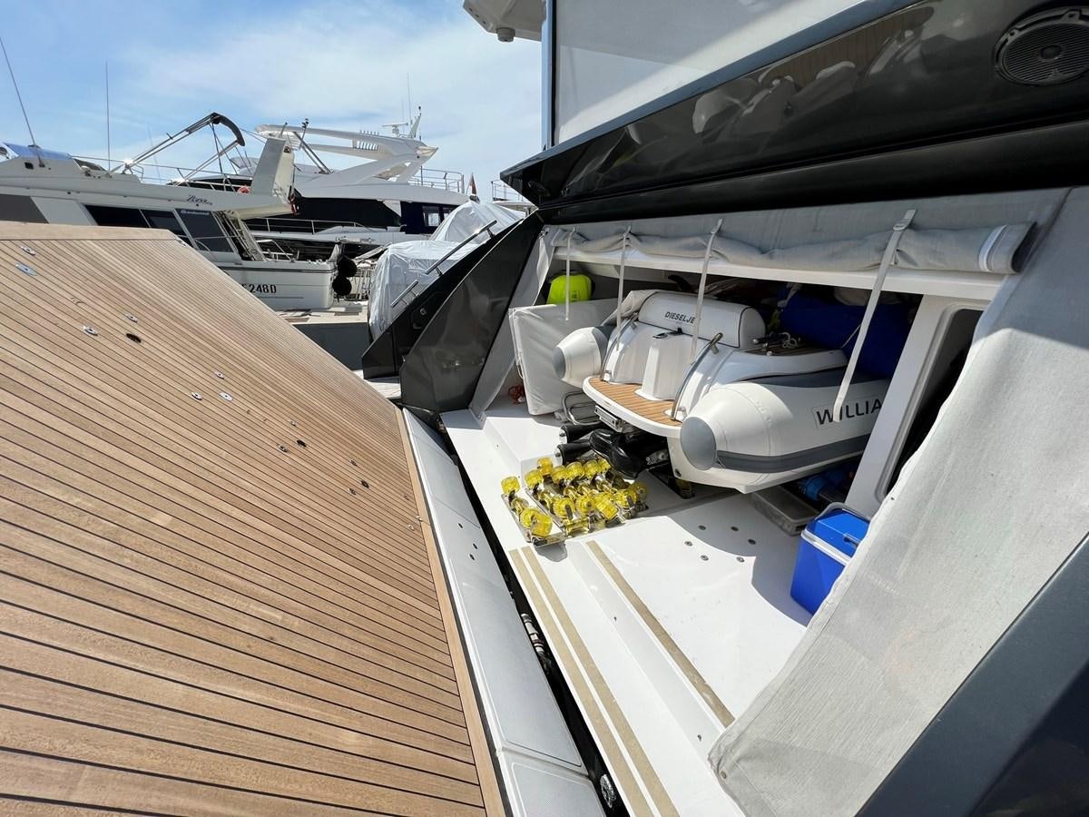a boat with a yellow substance on the front aboard QUEEN ANA Yacht for Sale