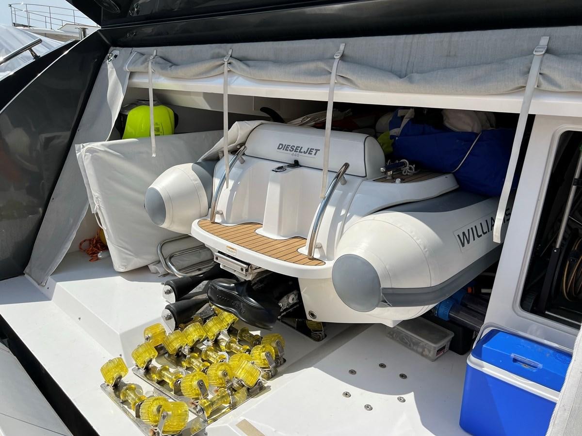 a car with a hood open aboard QUEEN ANA Yacht for Sale