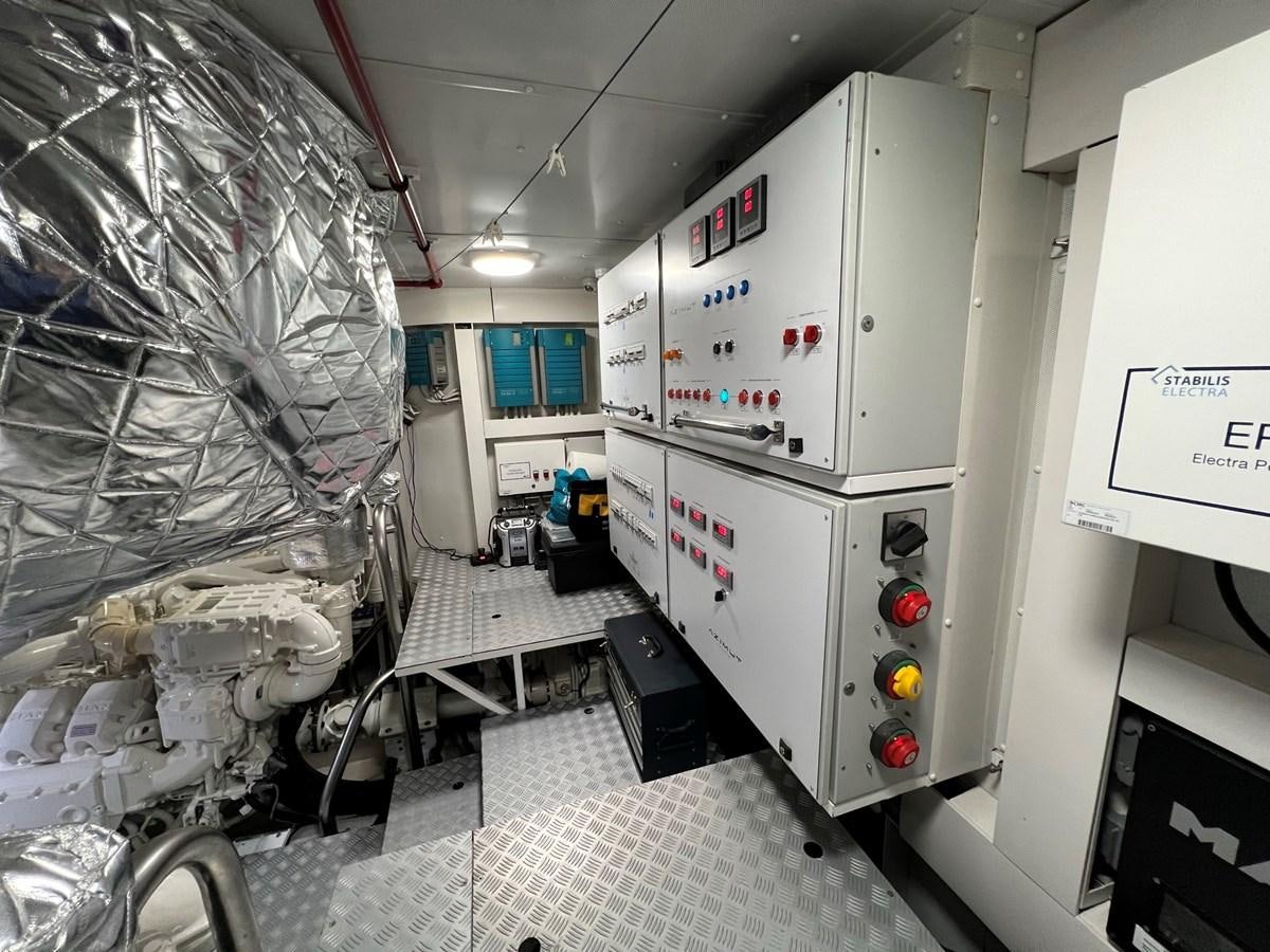 a room with machines and lights aboard QUEEN ANA Yacht for Sale