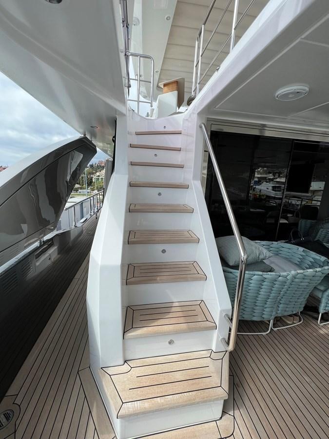 a wooden staircase in a room aboard QUEEN ANA Yacht for Sale