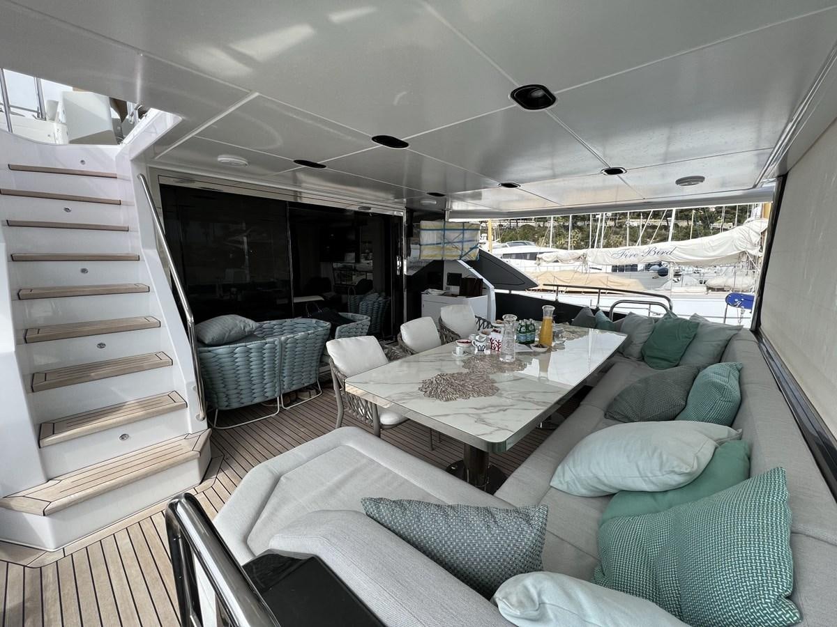 a boat with a table and chairs aboard QUEEN ANA Yacht for Sale