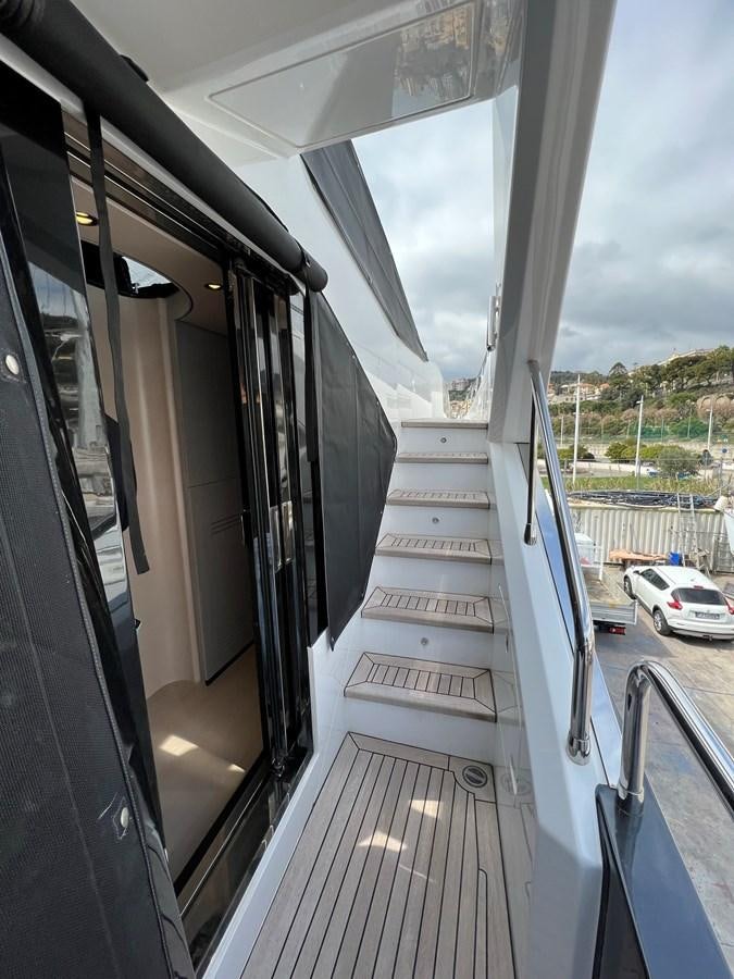 a large balcony with a view of a street and cars aboard QUEEN ANA Yacht for Sale