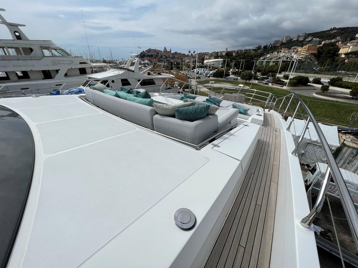 a rooftop of a building with a large building in the background aboard QUEEN ANA Yacht for Sale