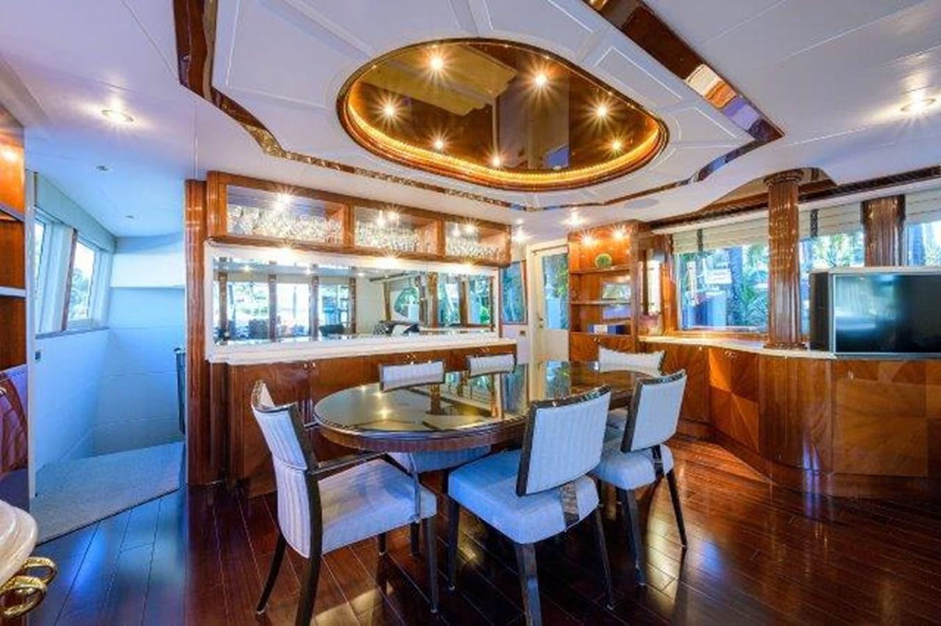 a dining room with a table and chairs aboard SUZANNE Yacht for Sale