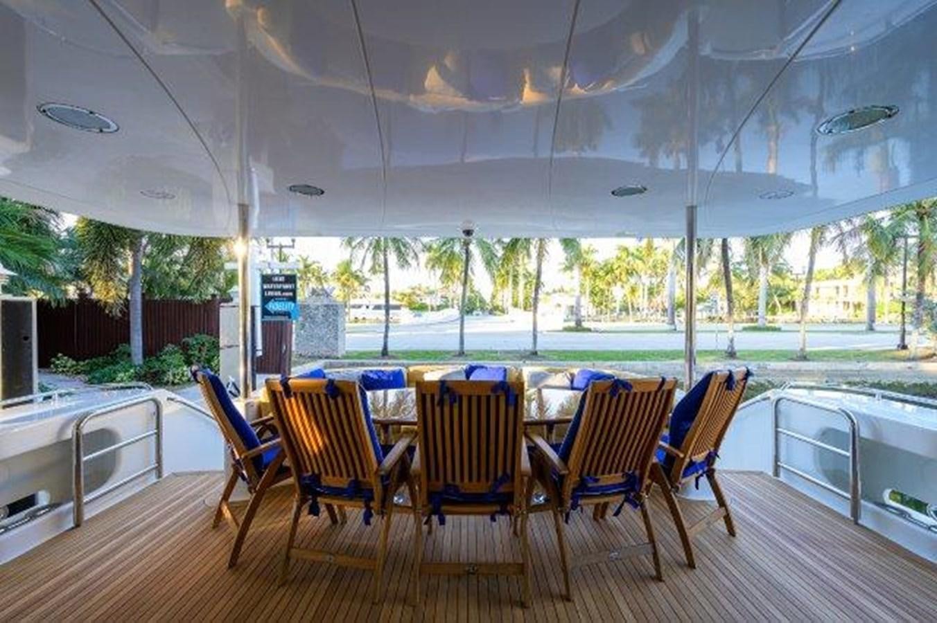 a group of chairs on a deck aboard SUZANNE Yacht for Sale
