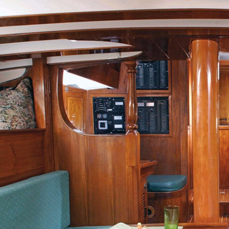 a wooden cabinet with a shelf aboard CURLEW Yacht for Sale