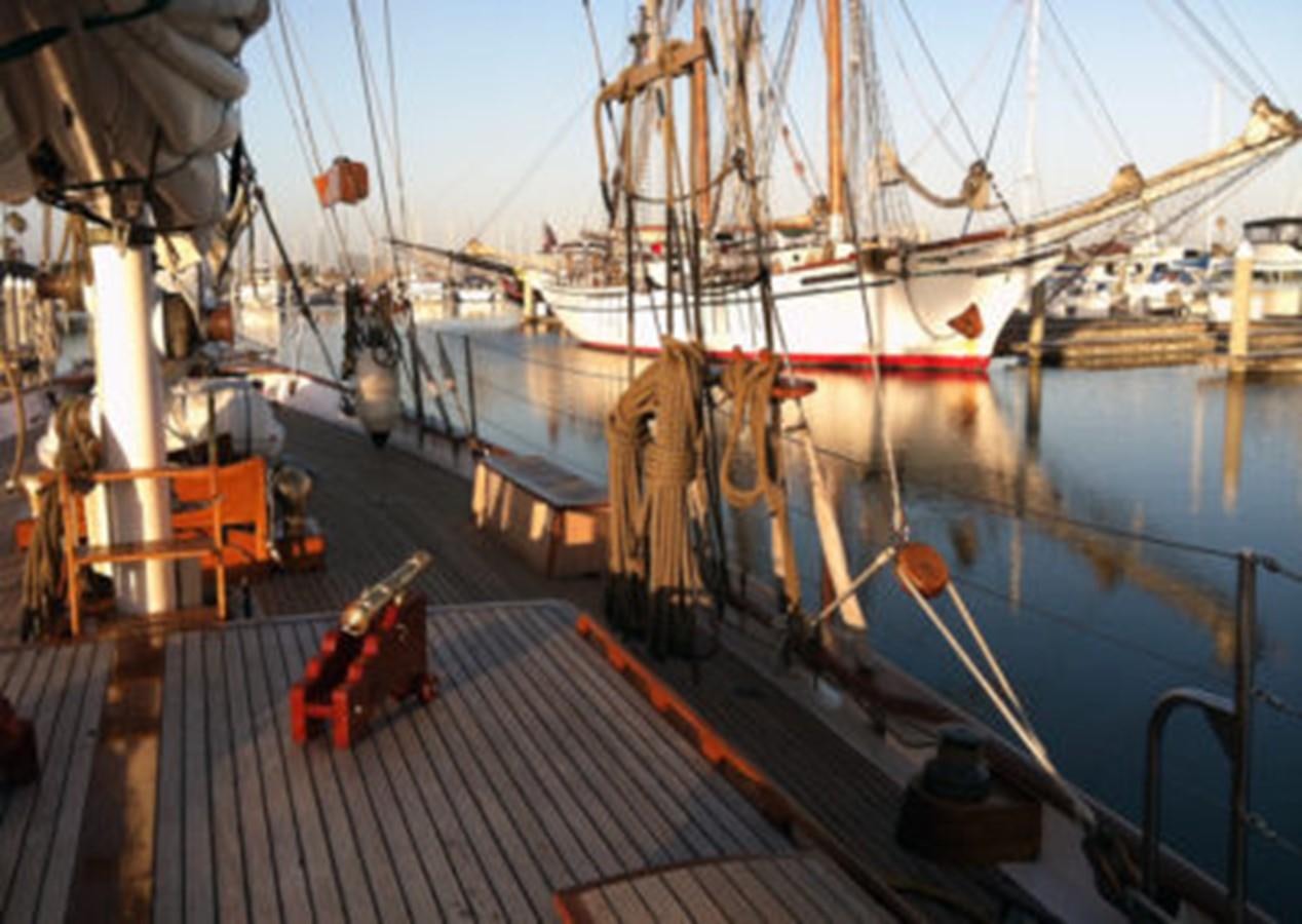 a large ship docked aboard CURLEW Yacht for Sale
