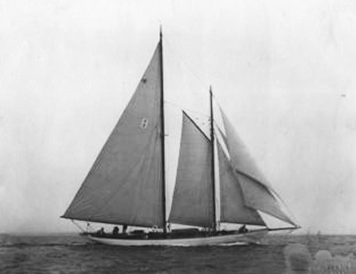 a black and white photo of a sailboat on the water aboard CURLEW Yacht for Sale