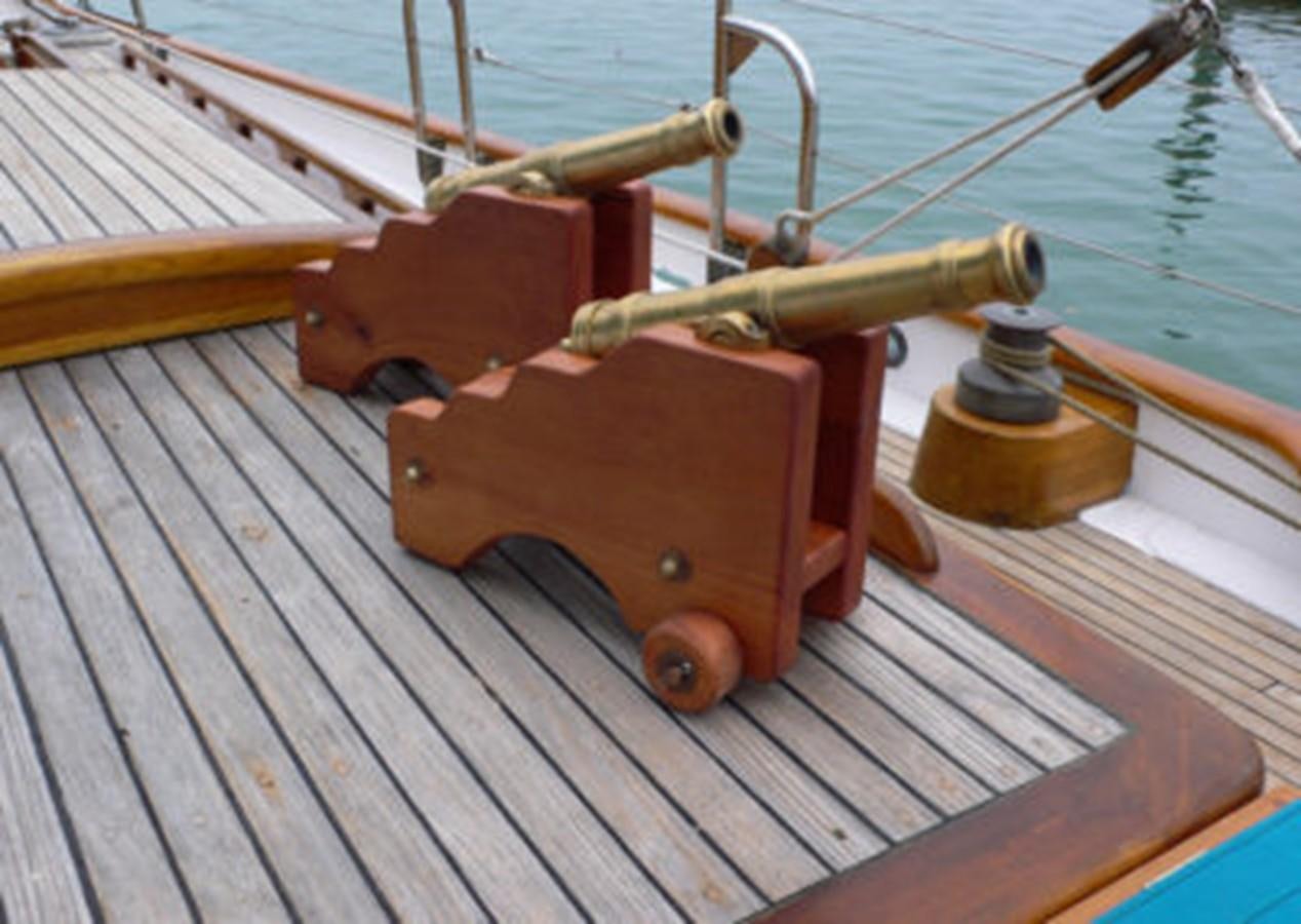 a wooden boat on a dock aboard CURLEW Yacht for Sale