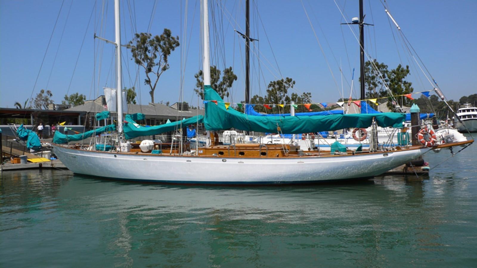 a boat docked at a pier aboard CURLEW Yacht for Sale