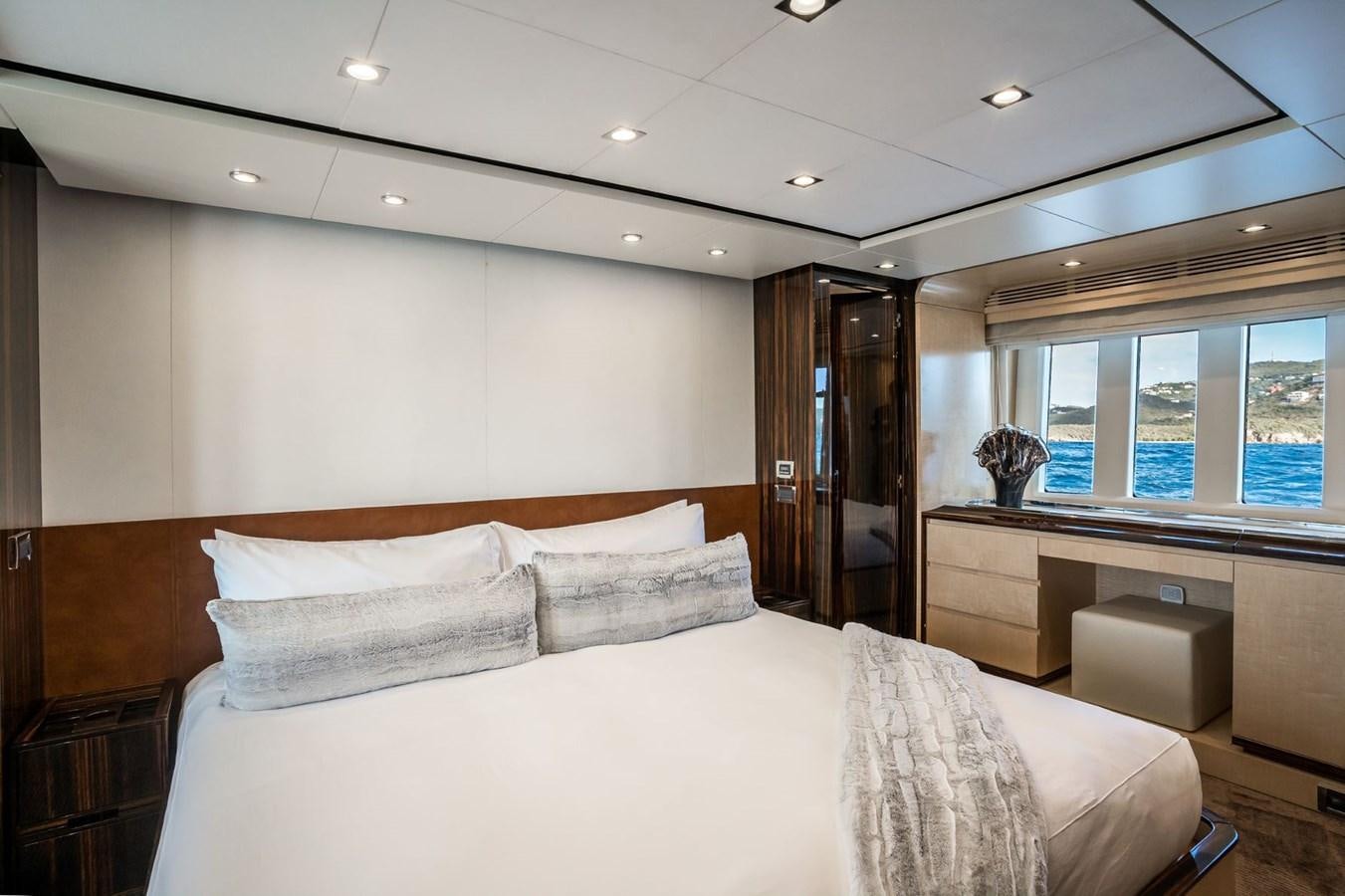 a bedroom with a large bed aboard Valere Yacht for Sale