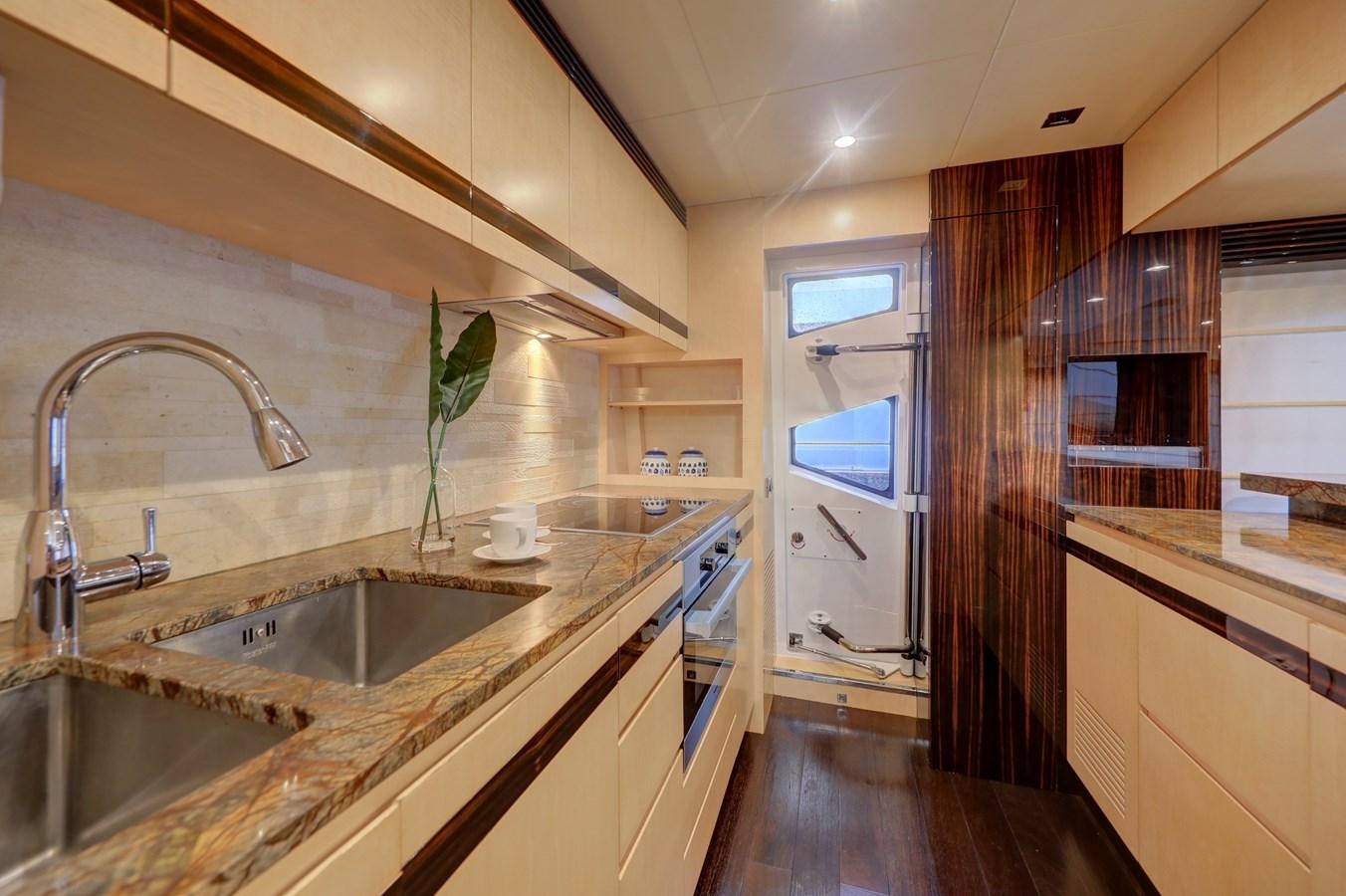 a kitchen with a sink and cabinets aboard Valere Yacht for Sale