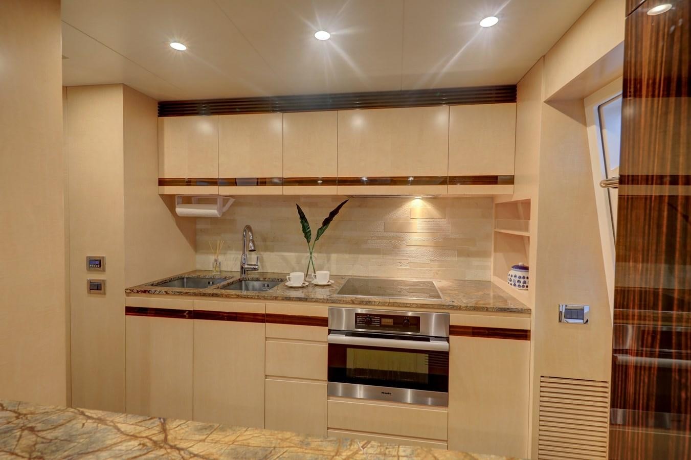 a kitchen with a sink and a stove aboard Valere Yacht for Sale
