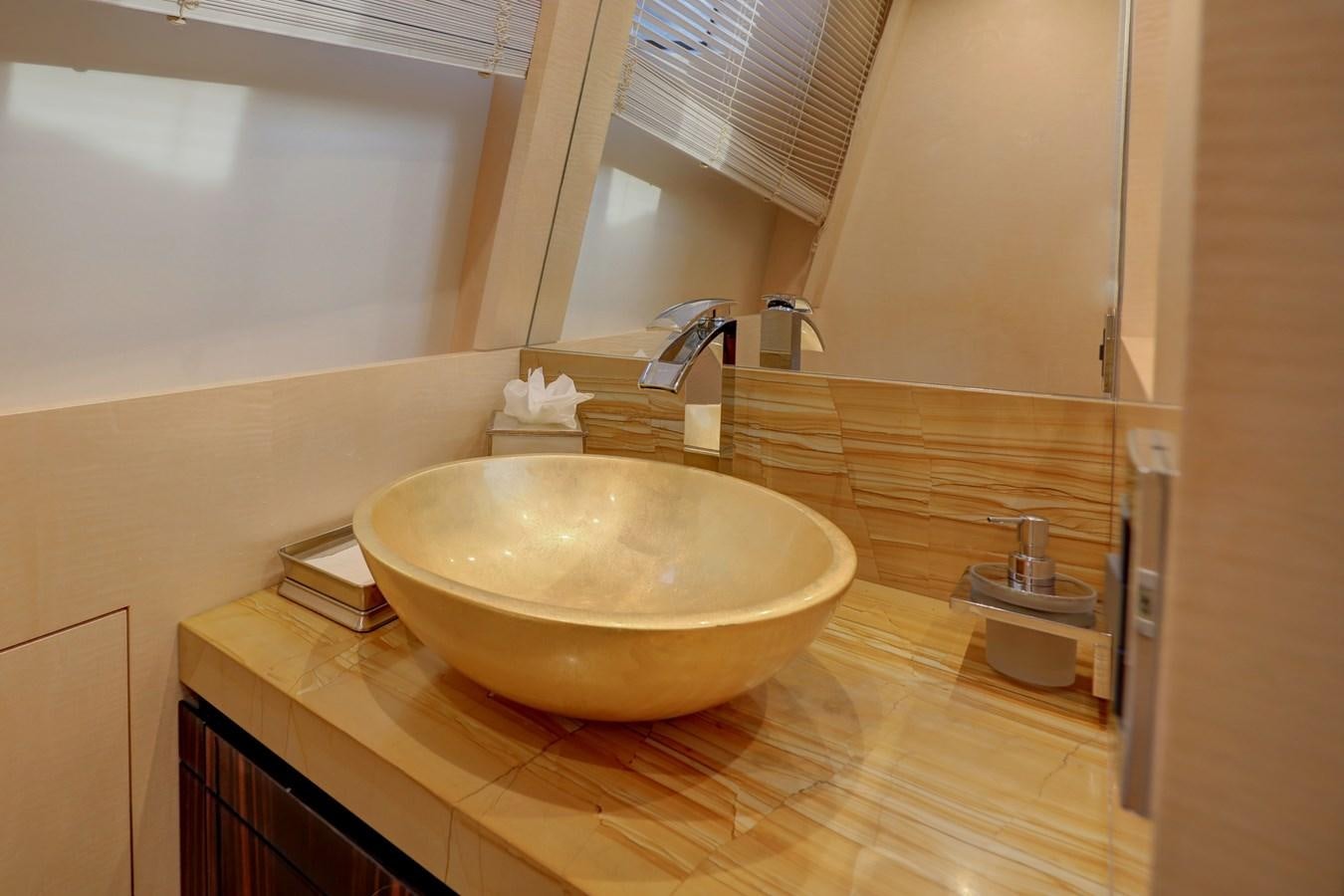 a bathroom with a sink and a mirror aboard Valere Yacht for Sale