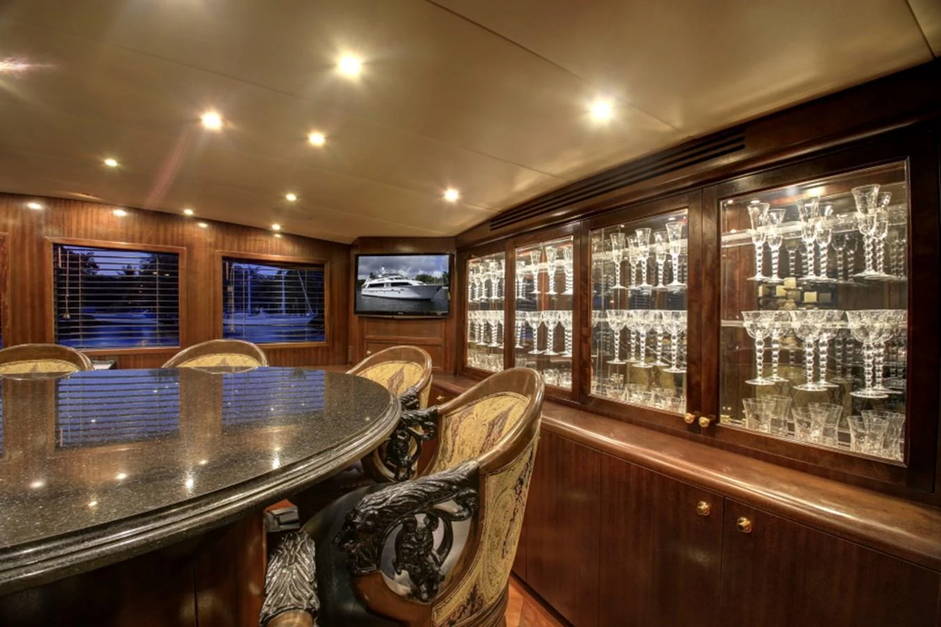 a room with a table and chairs aboard SUNDAY MONEY Yacht for Sale