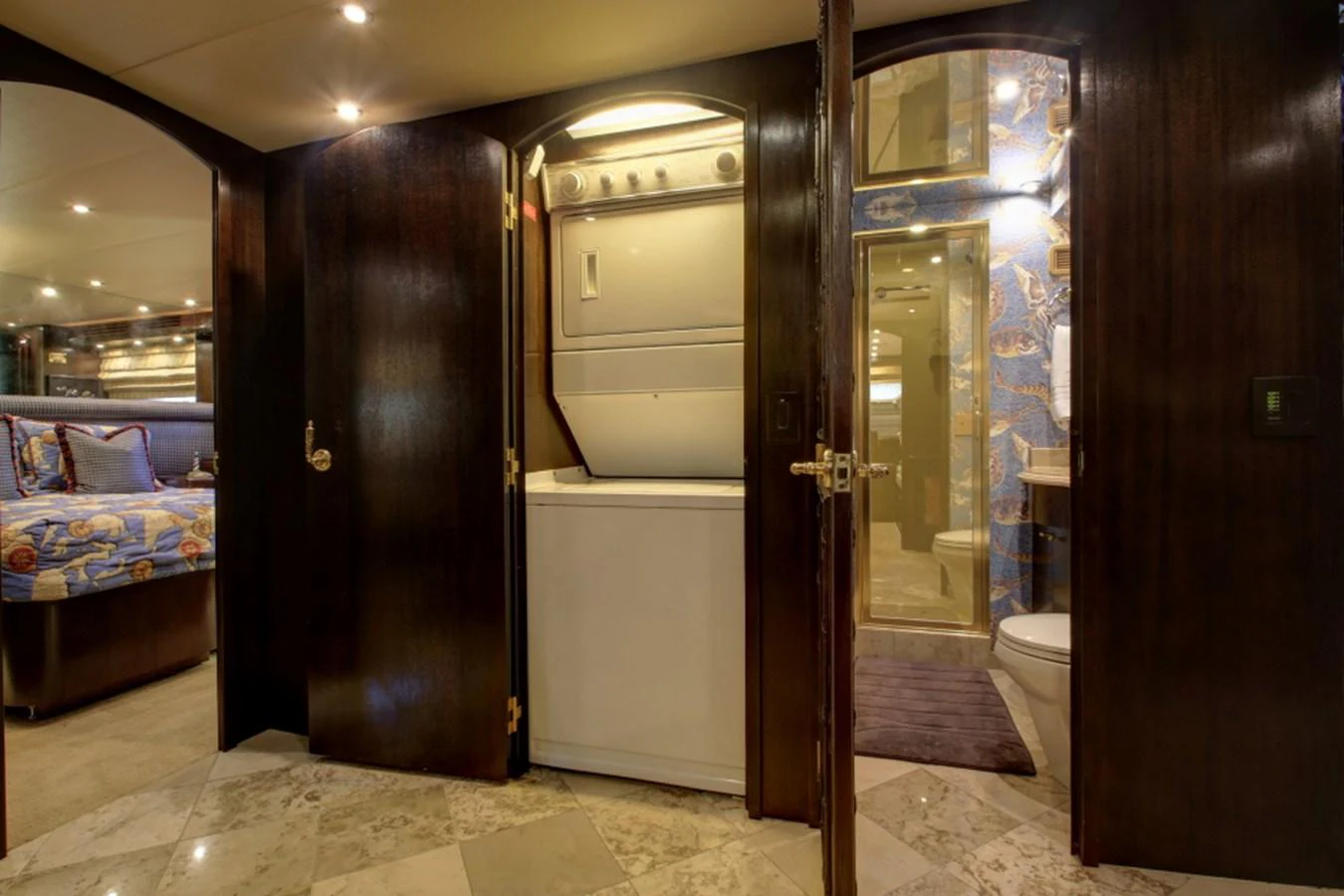 a room with a bed and a door aboard SUNDAY MONEY Yacht for Sale