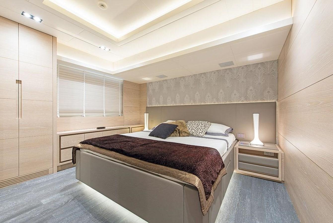 a bedroom with two beds aboard FAST & FURIOUS Yacht for Sale