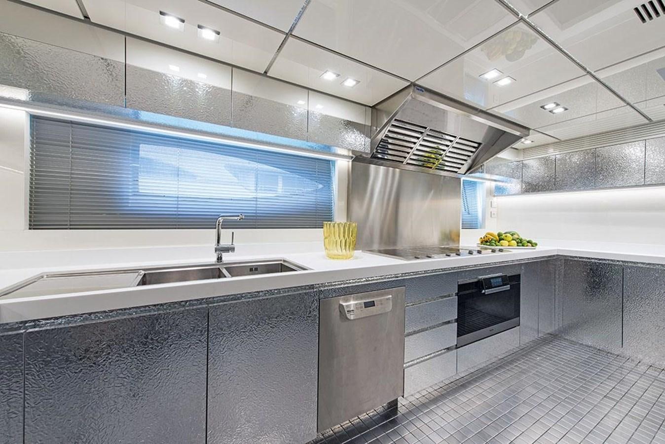 a kitchen with a large island aboard FAST & FURIOUS Yacht for Sale