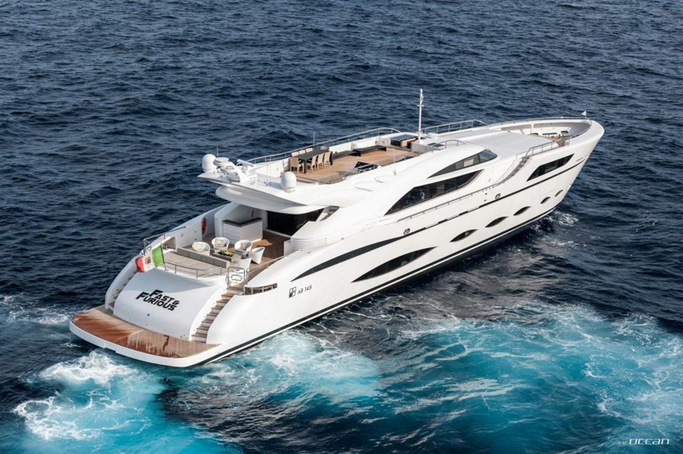 a white boat in the water aboard FAST & FURIOUS Yacht for Sale