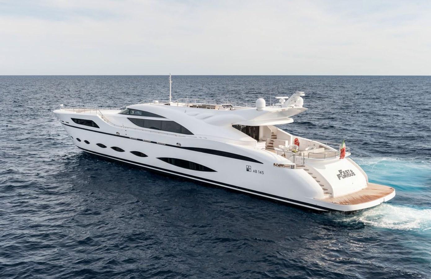 a white yacht in the water aboard FAST & FURIOUS Yacht for Sale