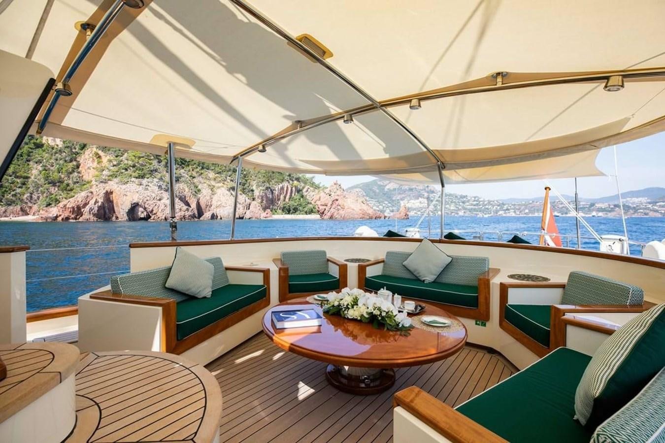 a room with a table and chairs aboard NORFOLK STAR Yacht for Charter