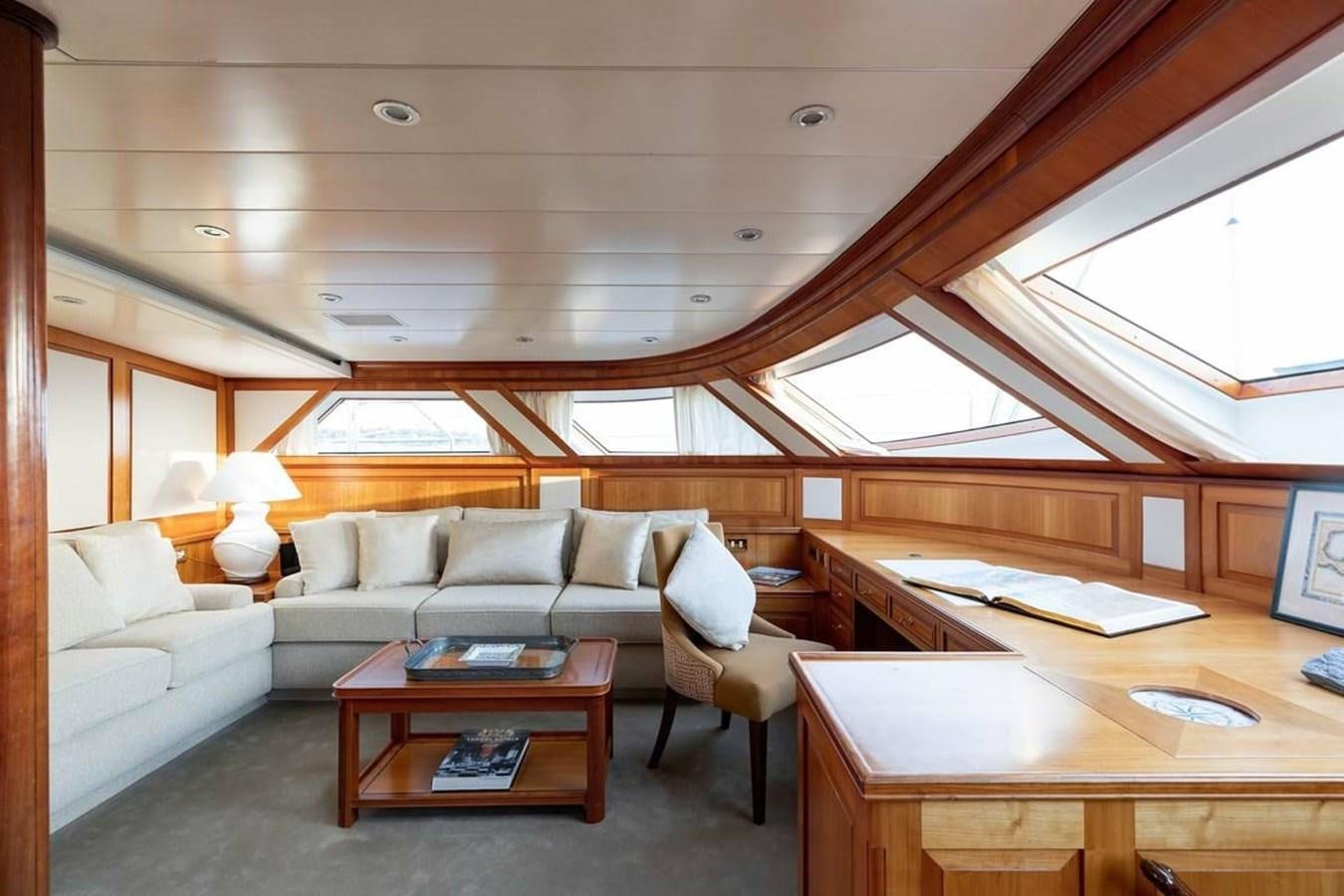 a living room with a couch and a coffee table aboard NORFOLK STAR Yacht for Charter