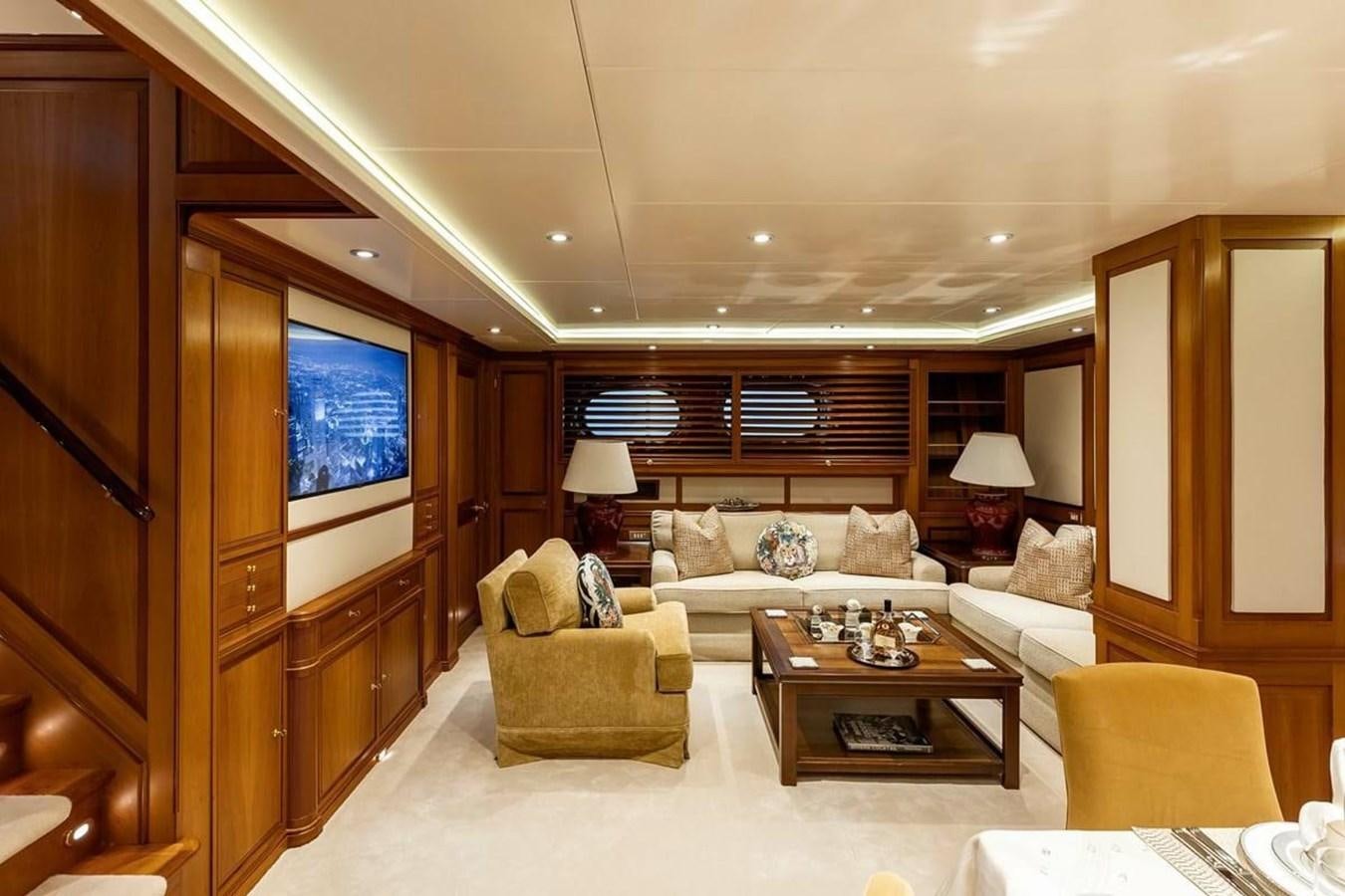 a living room with a large mirror aboard NORFOLK STAR Yacht for Charter