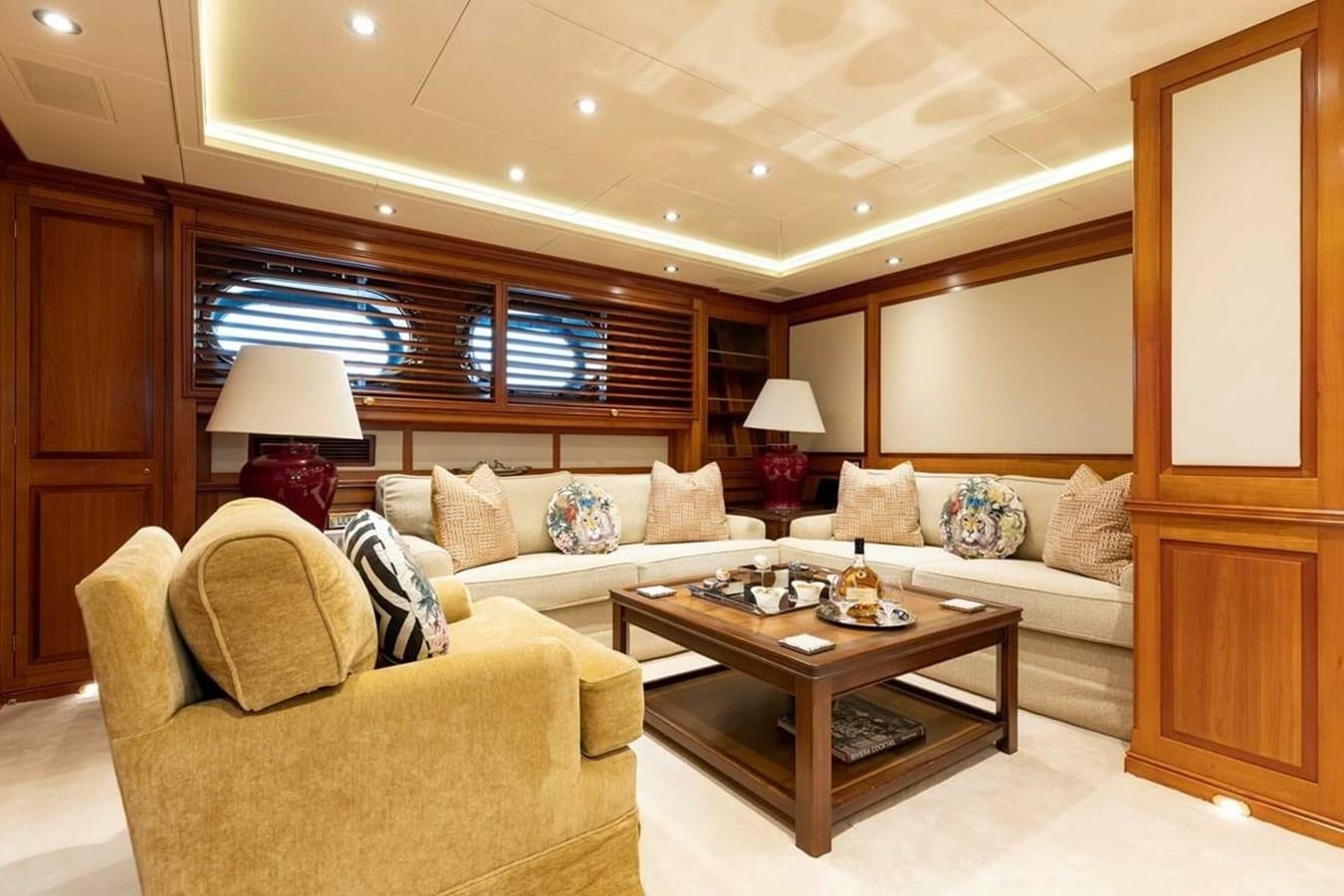 a living room with a couch and a coffee table aboard NORFOLK STAR Yacht for Charter