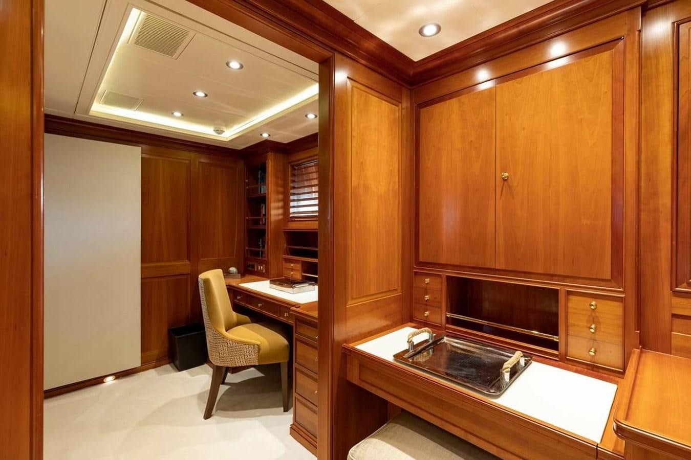 a kitchen with wooden cabinets aboard NORFOLK STAR Yacht for Charter