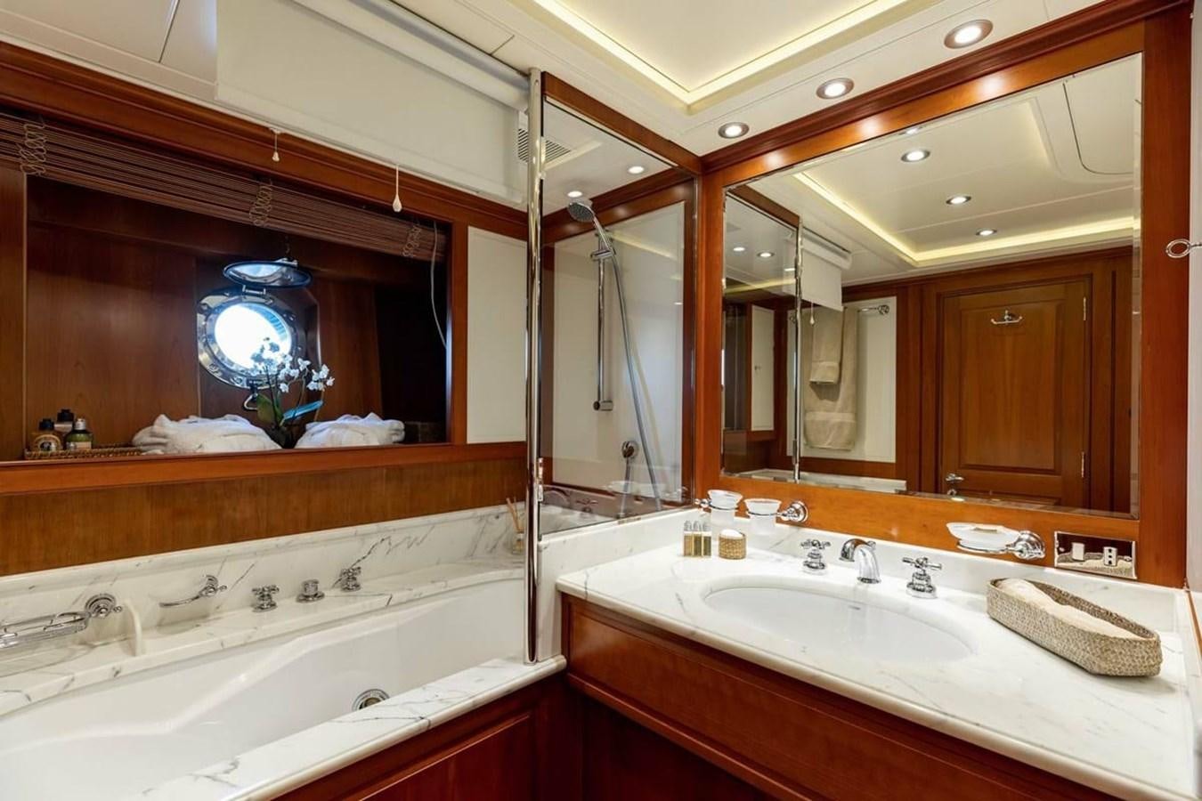 a bathroom with a large mirror aboard NORFOLK STAR Yacht for Charter