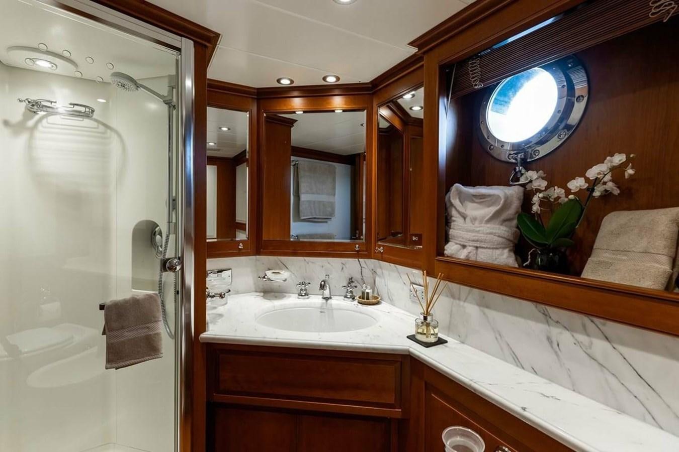 a bathroom with a large mirror aboard NORFOLK STAR Yacht for Charter