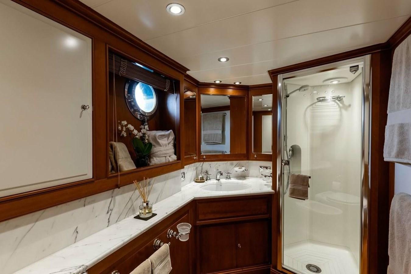 a bathroom with a large mirror aboard NORFOLK STAR Yacht for Charter