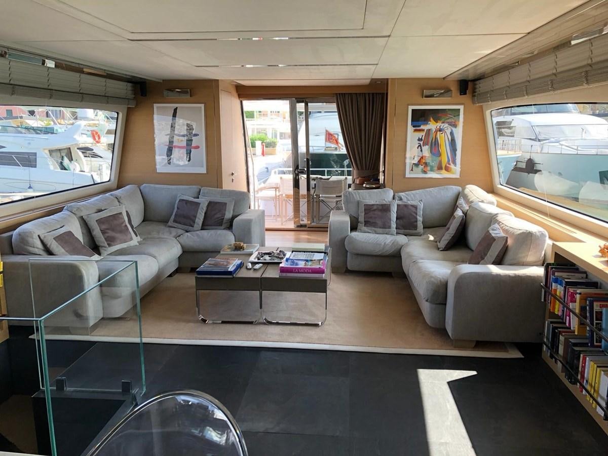 a living room with a large window aboard VISIONARIA Yacht for Sale