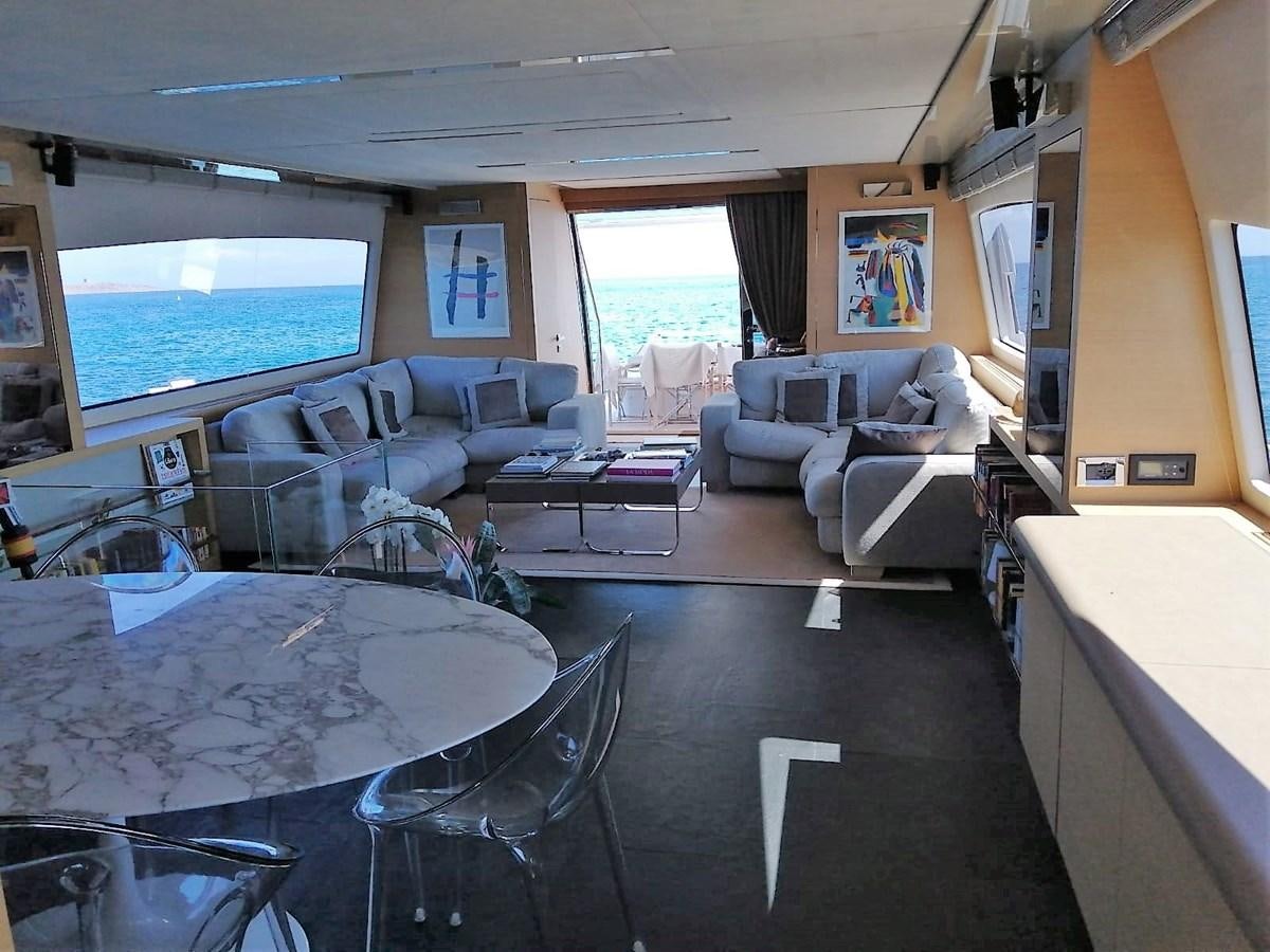 a living room with a large window aboard VISIONARIA Yacht for Sale
