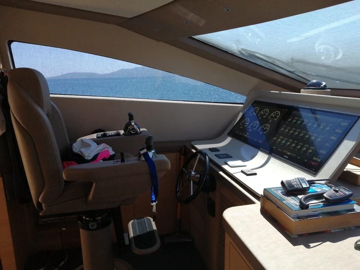 a desk with a computer and a chair aboard VISIONARIA Yacht for Sale