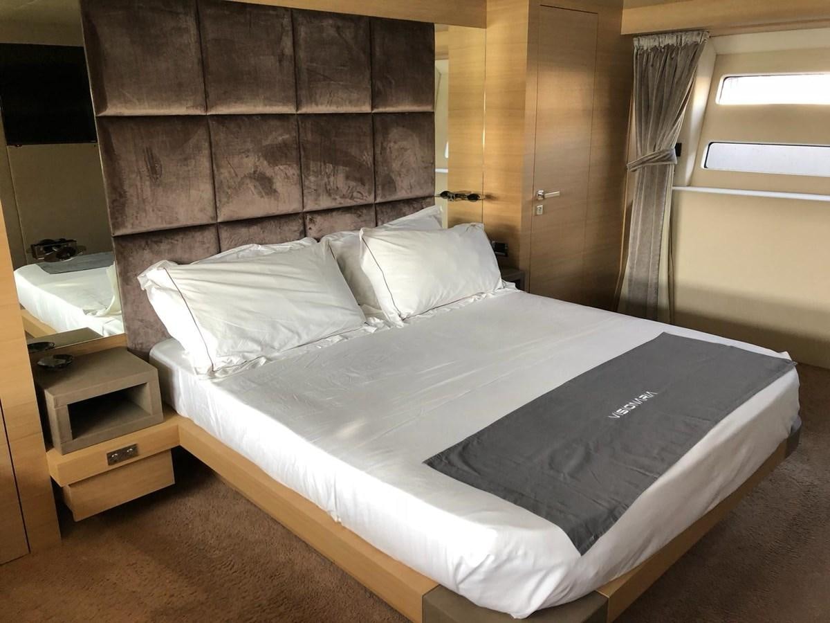 a bed with white sheets aboard VISIONARIA Yacht for Sale
